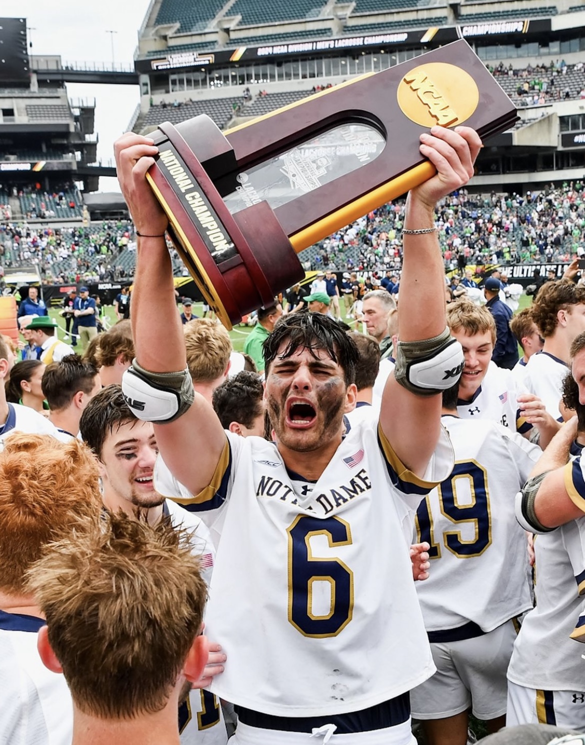Fisher Finley hoisting the National Championship trophy
